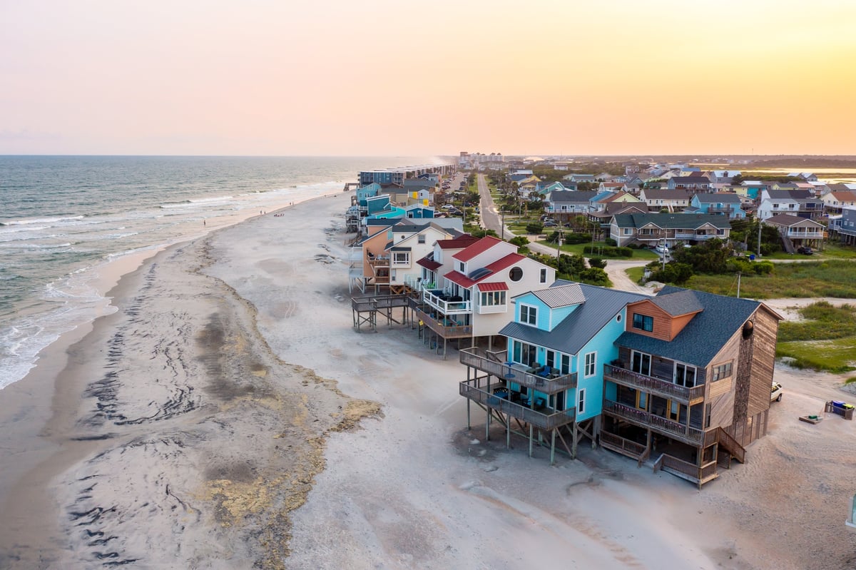 Aerial view of coastal homes and town along the coastline